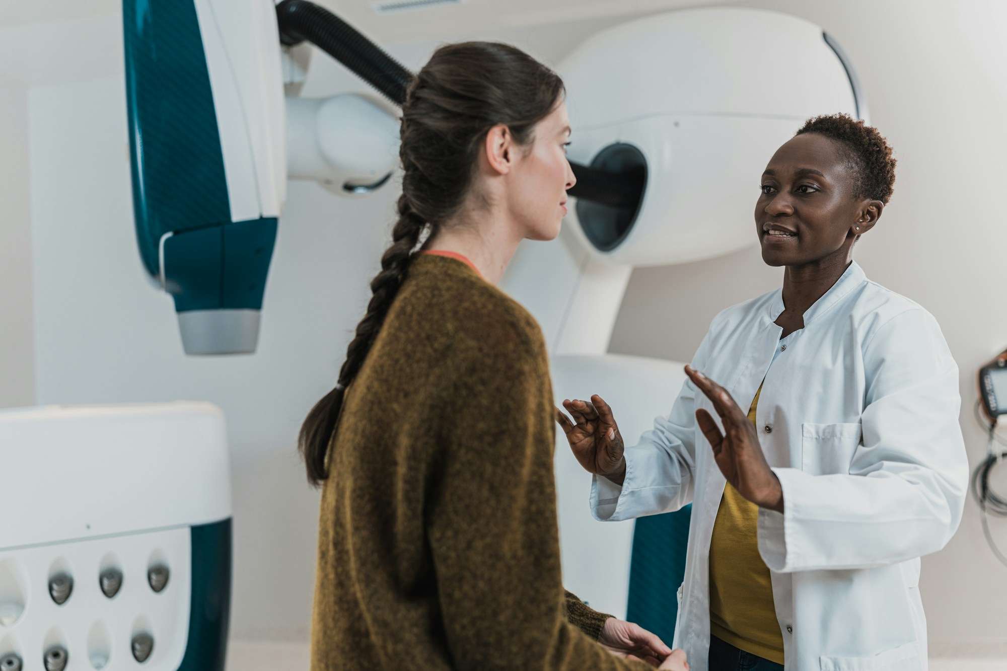 Clinician and patient in a warm consult conversation at the institute